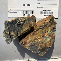 Grab sample containing 1.99 g/t gold, 489 g/t silver, 4.4% lead, 1,555 g/t zinc, and 1,636 g/t stibnite